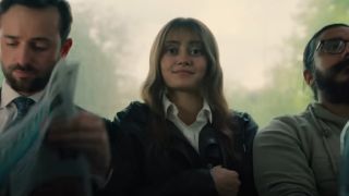 Ella Purnell sitting on a bus in the trailer for Sweetpea.