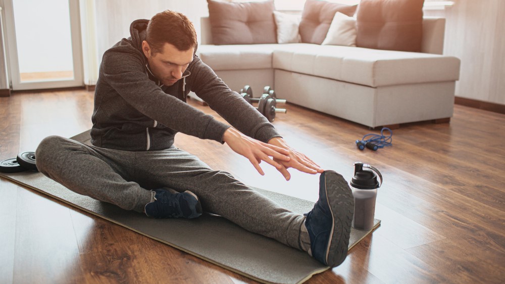 a photo of a man stretching 