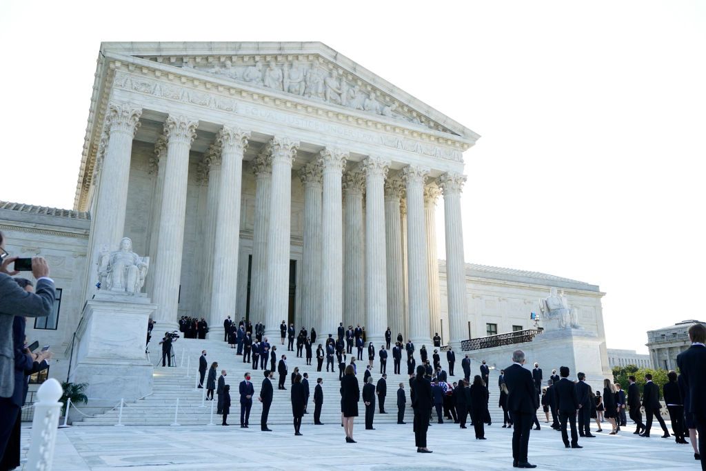 Ruth Bader Ginsburg&amp;#039;s former law clerks line the Supreme Court steps.