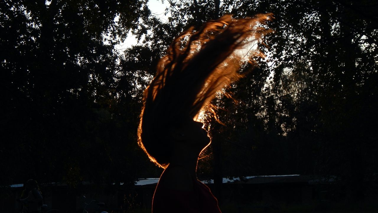 Side View Of Silhouette Woman Standing Against Trees At Night, Fire Signs Zodiac