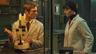 James Norton and Thomasin McKenzie (L-R) in the lab in Netflix's "Joy"