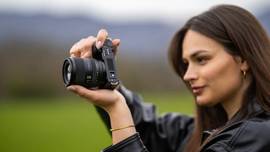 The Viltrox AF 90mm f/2.2 lens used by a photographer