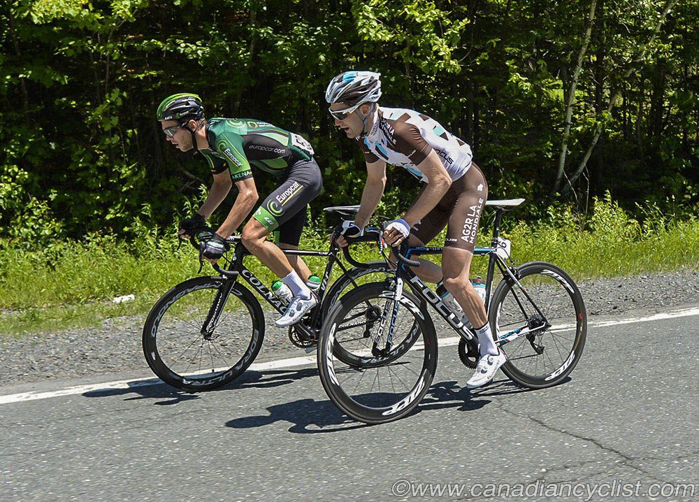 Antoine Duchesne (Team Europcar) and Hugo Houle (AG2R La Mondiale) chase back to the bunch after a crash in pelton