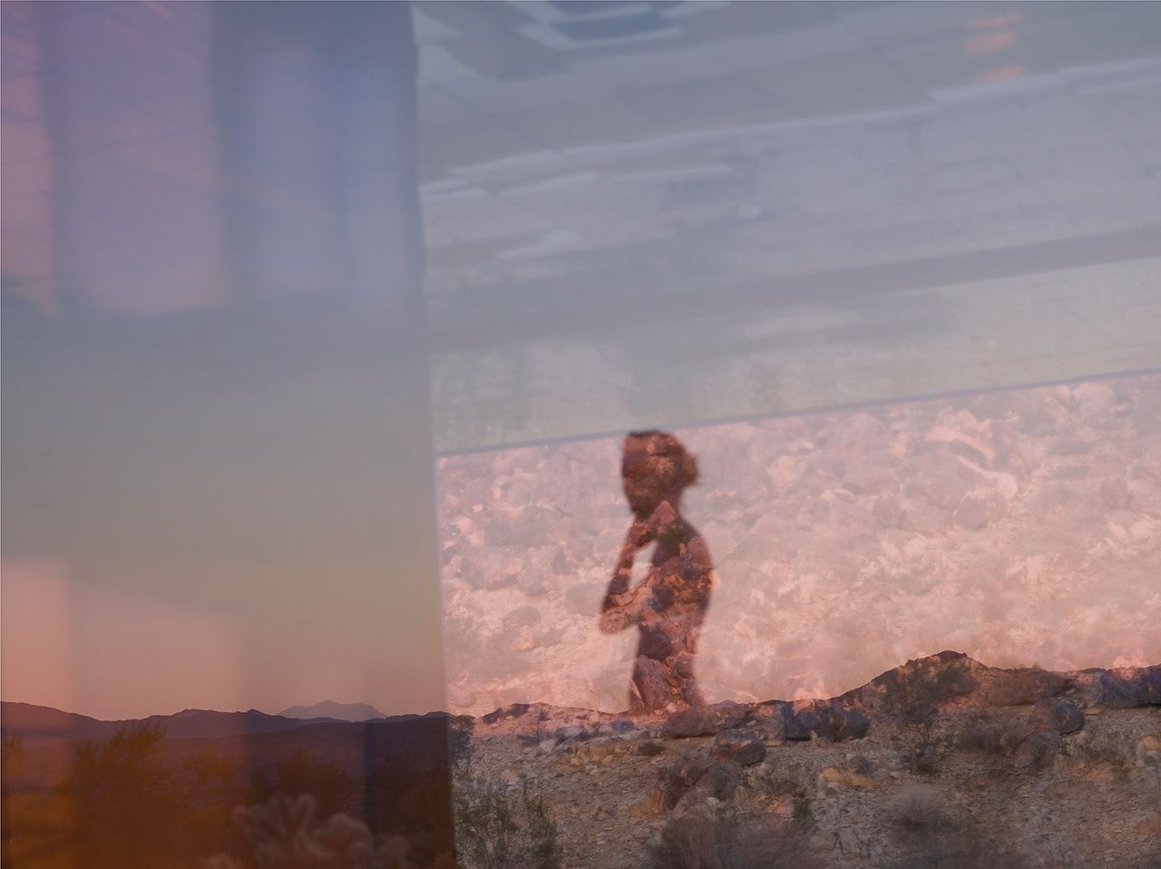 Photo by Mona Kuhn of the shadow of a woman on a rocky background