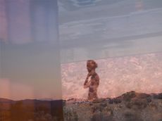 Photo by Mona Kuhn of the shadow of a woman on a rocky background