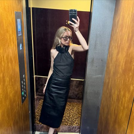 Stephanie Broek taking an elevator mirror selfie.