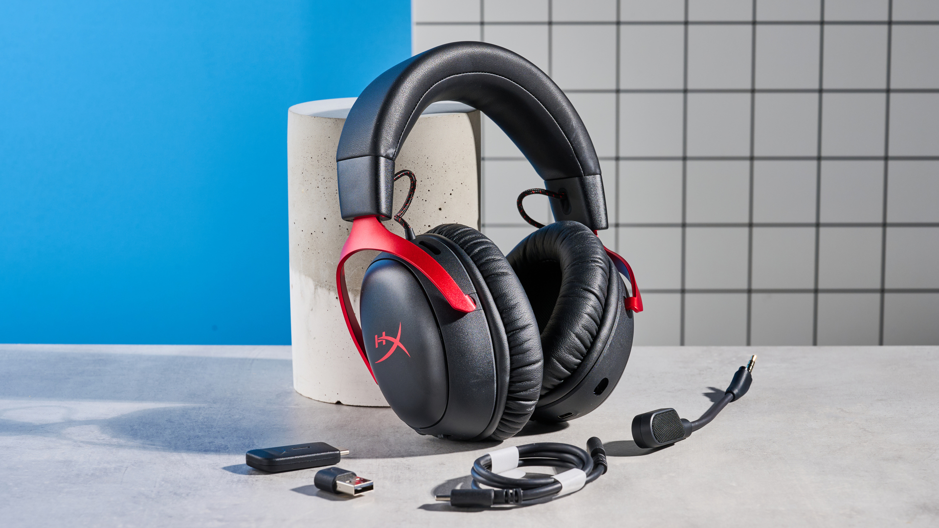A black and red HyperX Cloud III S Wireless gaming headset
