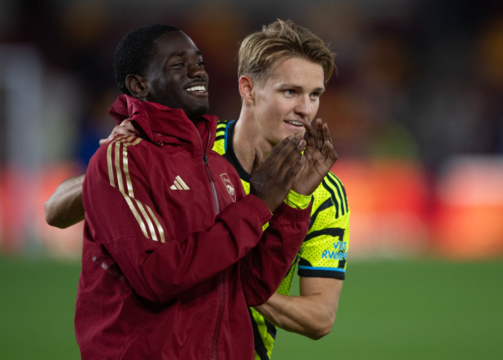 Martin Odegaard (R) pushes Charles Sagoe Jr (L) towards the Arsenal fans after the Carabao Cup Third Round match between Brentford and Arsenal at Gtech Community Stadium on September 27, 2023 in Brentford, England.
