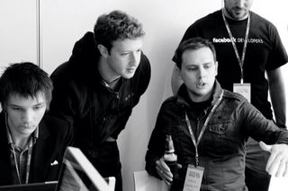 Mark Zuckerberg encourages developers to create great apps on his platform. Here, Steve Folkes and he share a discussion on an app under development at June's Facebook Hackathon event in London