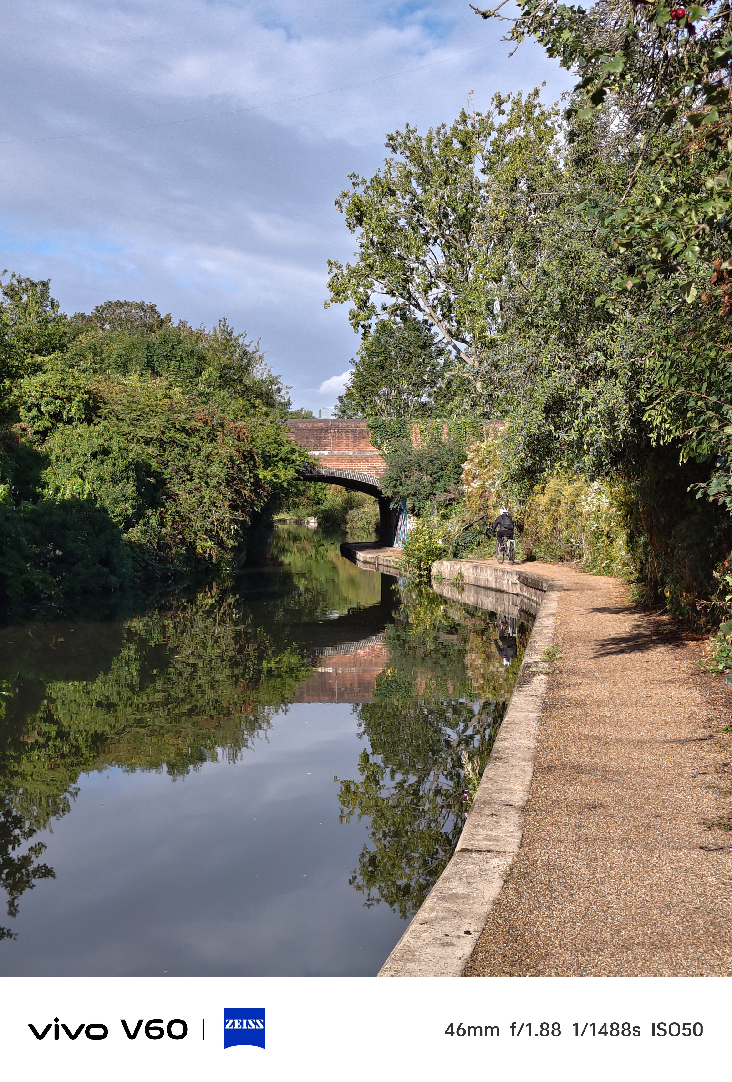 A path and down the side of Canal under a bridge