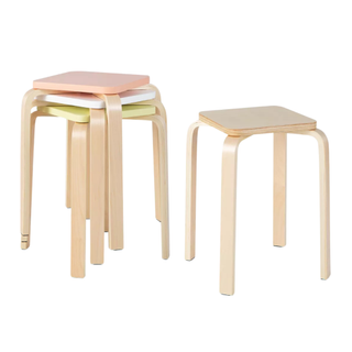 A set of light wood stackable stools with colorful seats