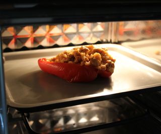 Reheating a stuffed pepper in the Our Place Wonder Oven