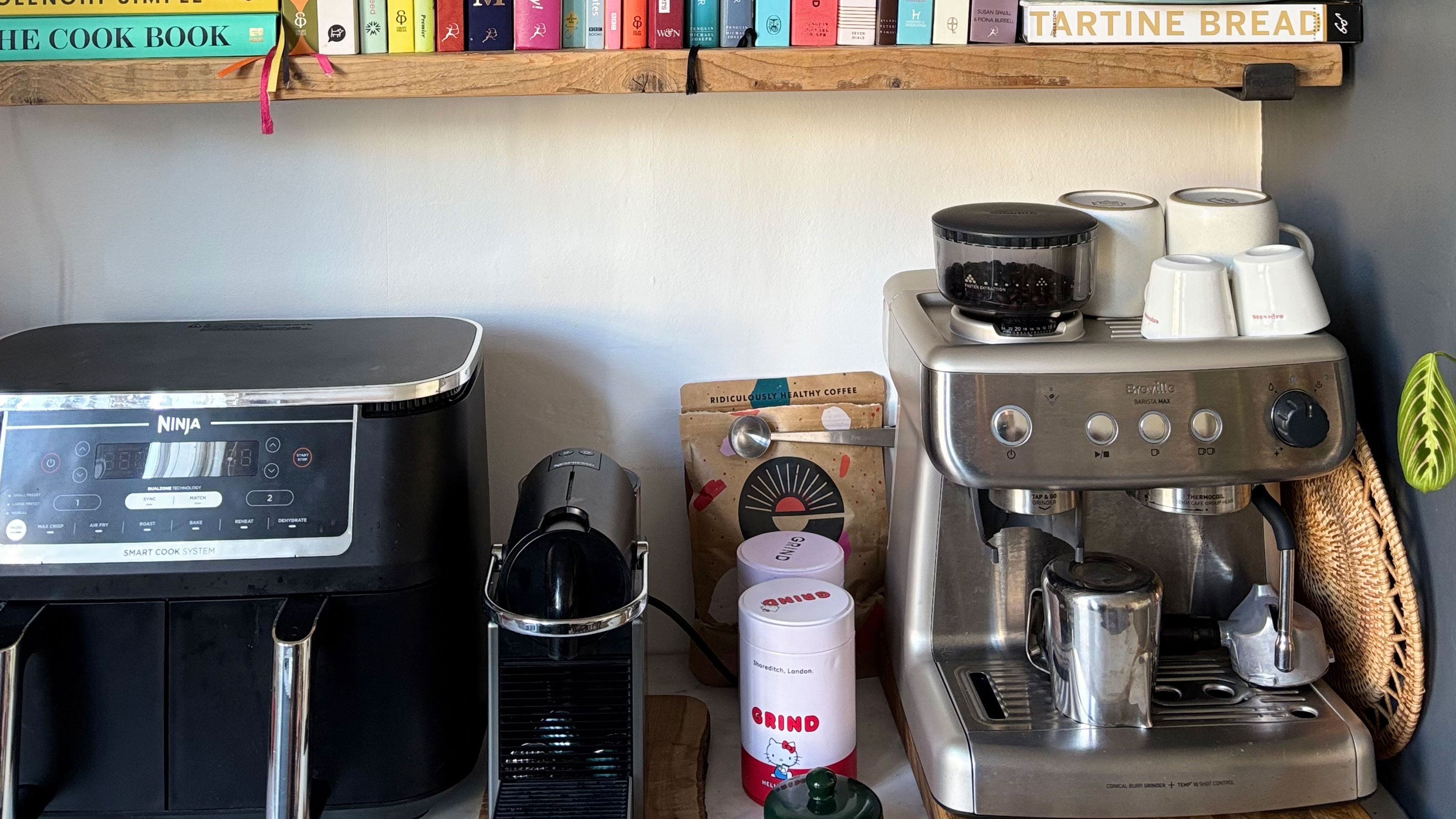 Coffee machine on a counter with a ninja air fryer