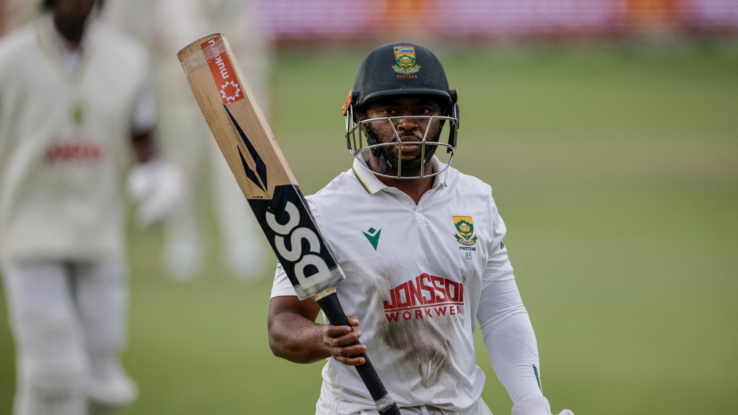 South Africa's Temba Bavuma acknowledges the crowd as he walks back to the pavilion following his dismissal on day three of the second Test match between South Africa and Australia