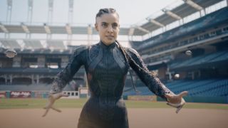 María Gabriela de Faría's getting ready to use her nanotech powers within a baseball stadium in Superman