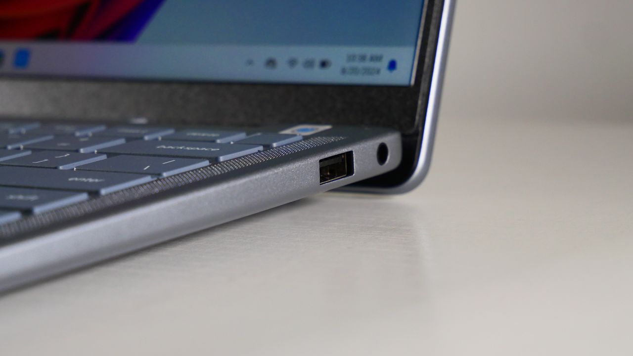 Close up of the ports on the right side of a Dell Inspiron 14 Plus 7441 (Snapdragon X Plus) on a white table.