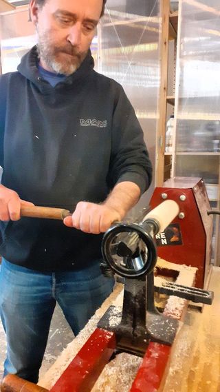 man working on a woodworking machine