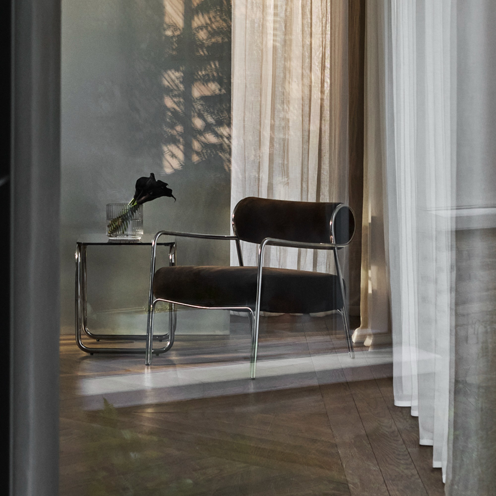 John Lewis Hoxton Armchair in a hallway with a chrome side table