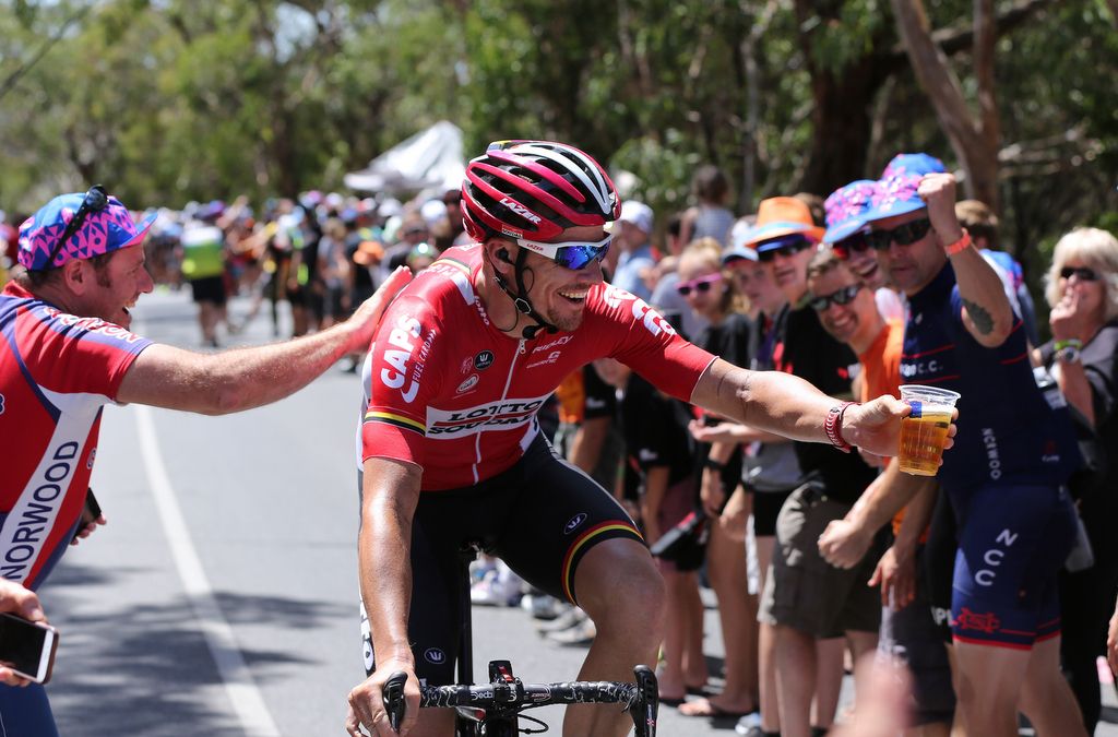 Adam Hansen takes a beer from the fans on Willunga Hill. The queen stage is usually packed with the fans