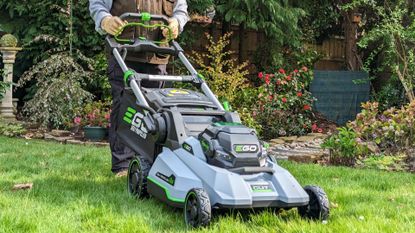 An image of Steve mowing the lawn with the EGO LM2130E mower