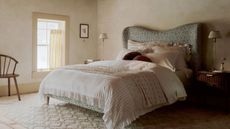 bedroom upgrades to help you sleep better country earthy bedroom with upholstered bed and striped ruffled bedding