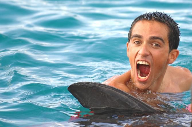 Alberto Contador clowning around with a dolphine