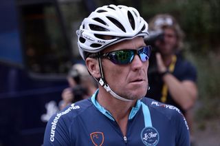 Lance Armstrong looks on upon his arrival in Rodez, southwest France, after riding a stage of The Tour De France for a leukaemia charity