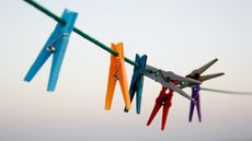 colorful clothespins hanging on clothesline