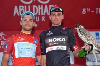 Race leader Andrea Guardini with sprint classification leader Paul Voss who holds a hawk