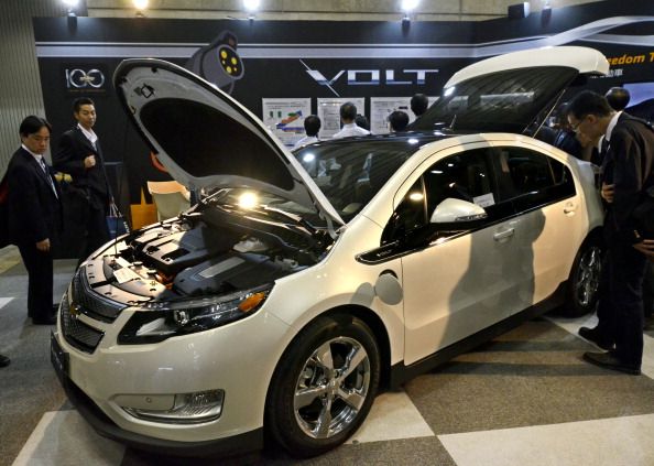 People admire a Chevy Volt