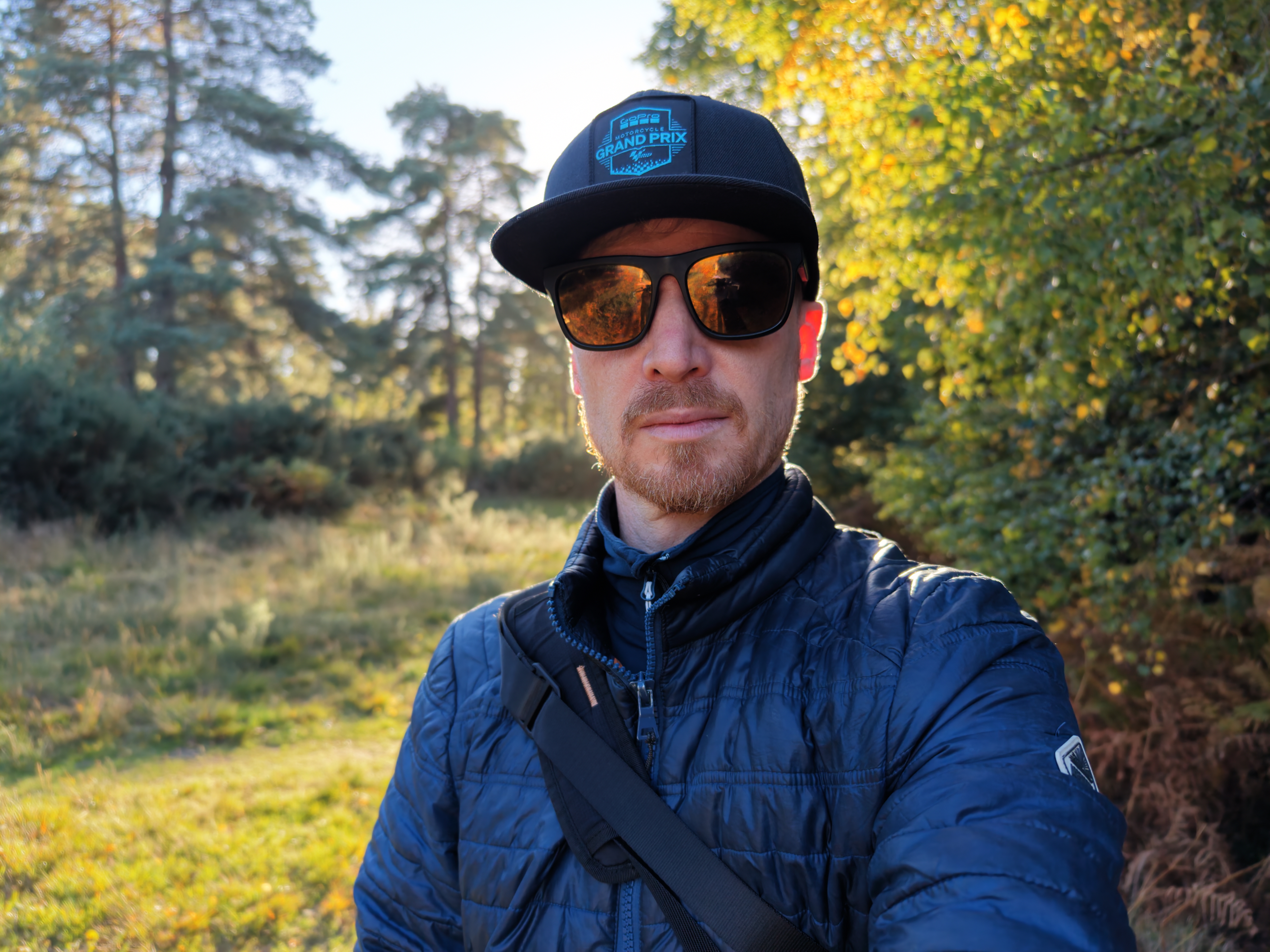DJI Mini 5 Pro sample images: male pilot in sunglasses, backlit