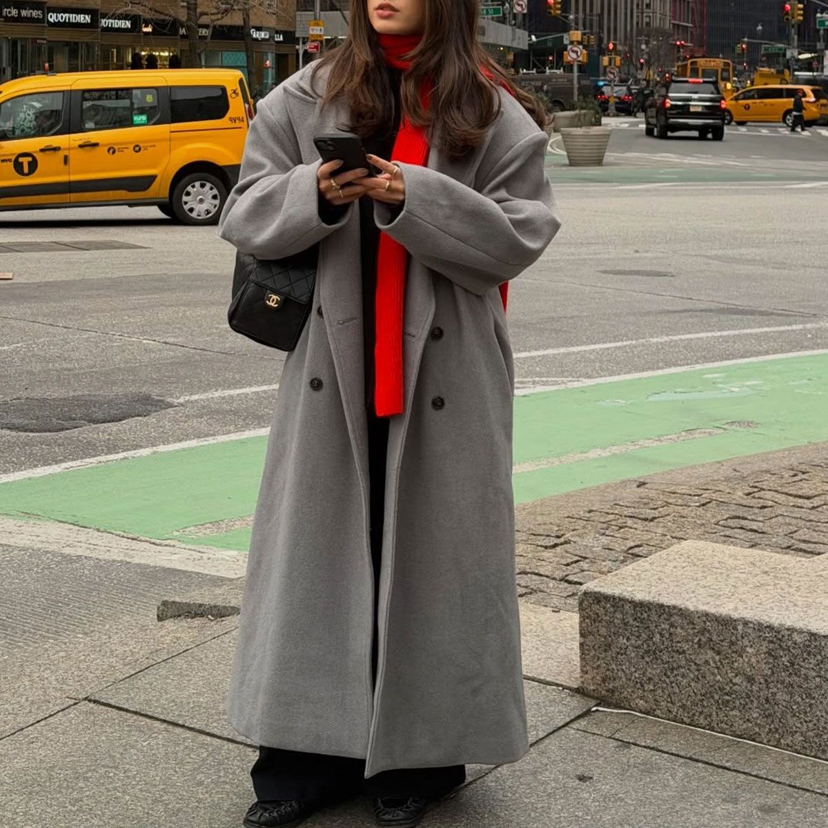 @tia_dewitt nyc winter outfit, grey long coat with a red scarf and chanel 25 bag