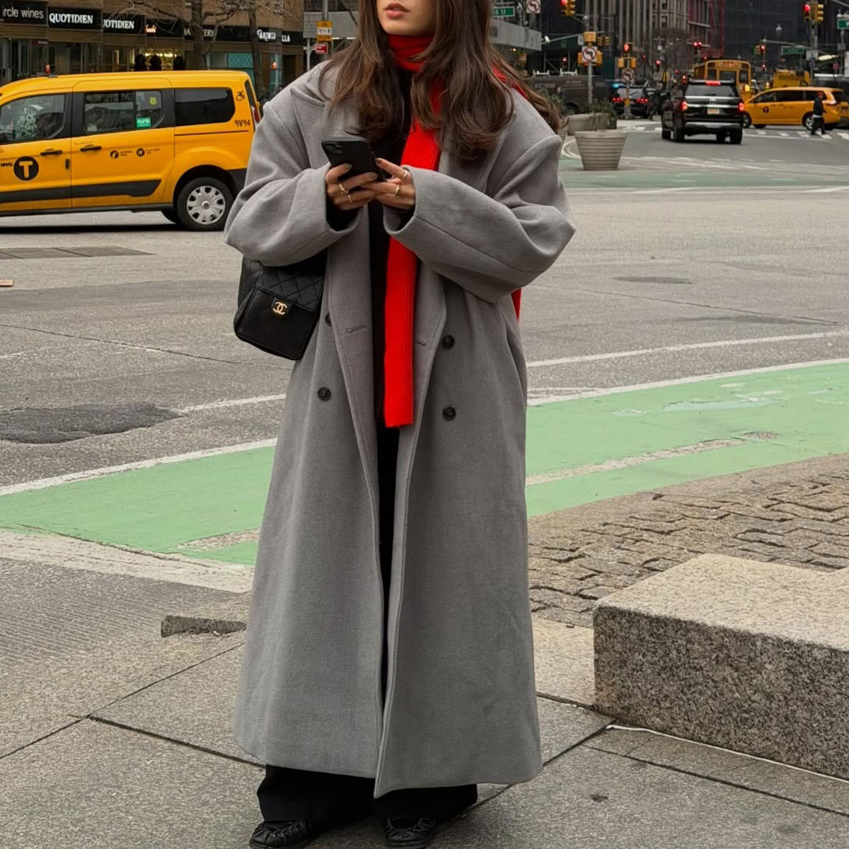 @tia_dewitt nyc winter outfit, grey long coat with a red scarf and chanel 25 bag