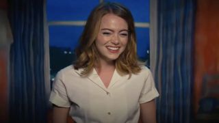 Emma Stone as Mia smiling as the audience applauses after her one-woman show in La La Land