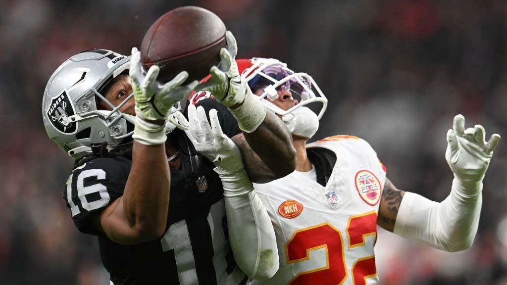 Jakobi Meyers #16 of the Las Vegas Raiders catches a pass in front of Trent McDuffie #22 of the Kansas City Chiefs for a first down during the third quarter of a game at Allegiant Stadium on November 26, 2023