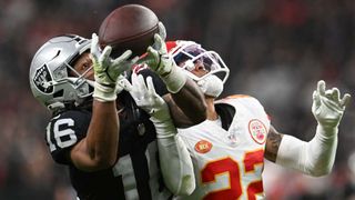 Jakobi Meyers #16 of the Las Vegas Raiders catches a pass in front of Trent McDuffie #22 of the Kansas City Chiefs for a first down during the third quarter of a game at Allegiant Stadium on November 26, 2023