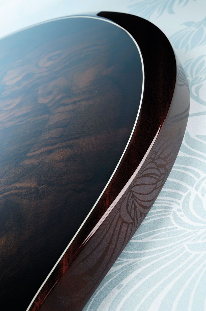The Custom features a walnut burl veneered top