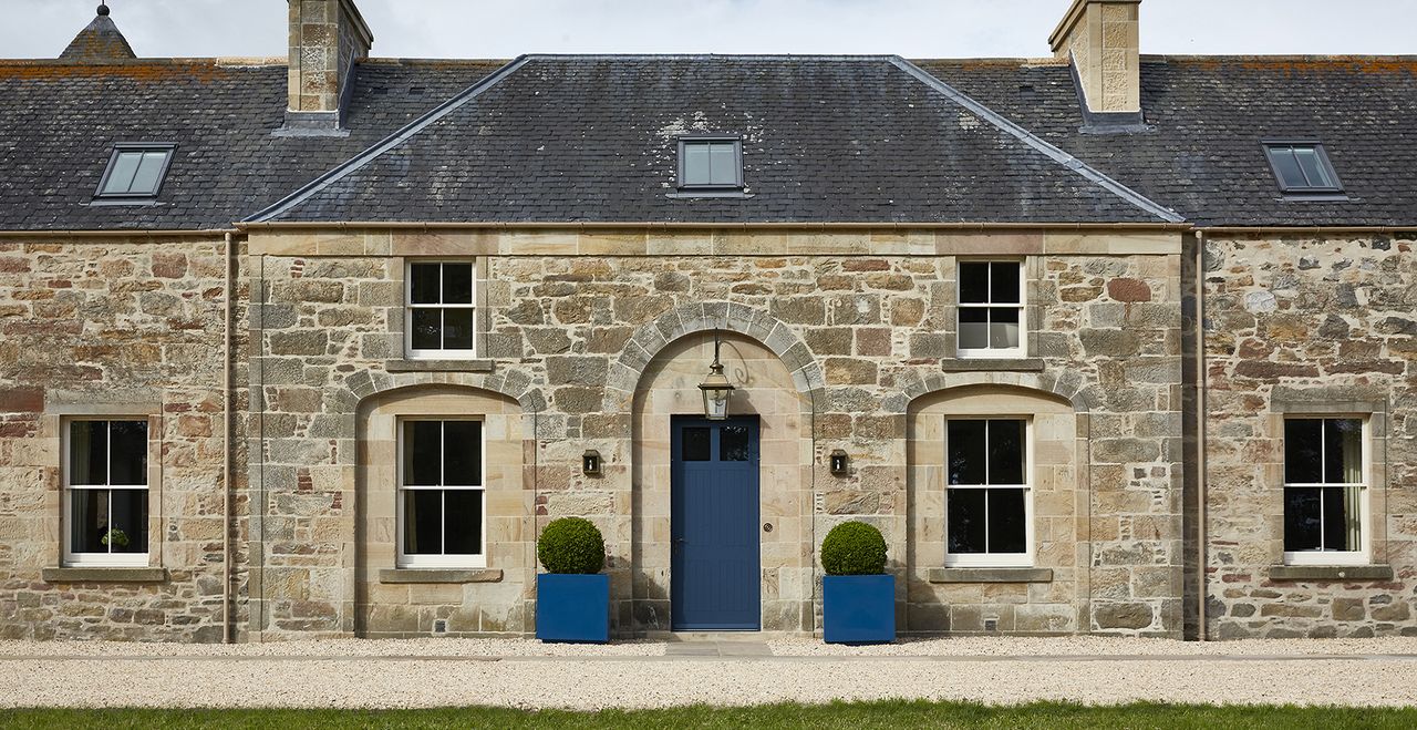 exterior of stone house with sash windows