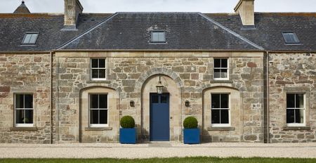 exterior of stone house with sash windows