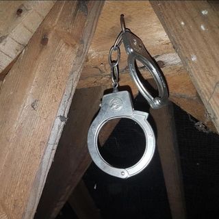 hanging handcuffs on wood