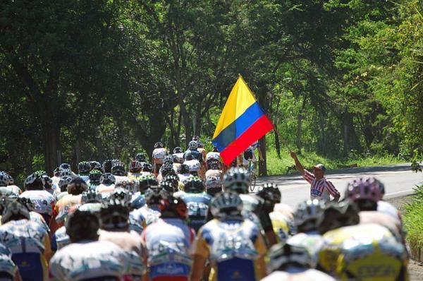 The Colombian flag flies proudly alongside the peloton contesting its national tour.