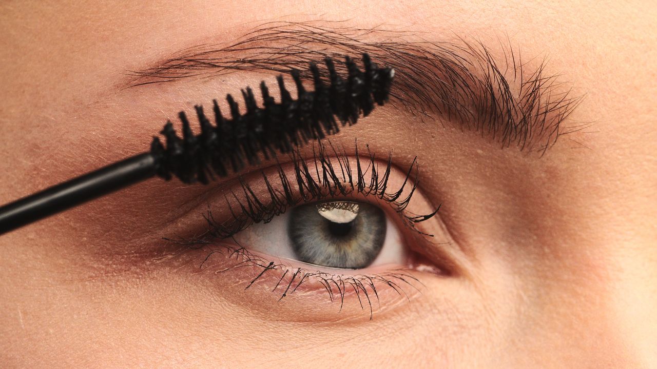 Lancôme Mascara - close up image of a woman&#039;s eye having mascara applied