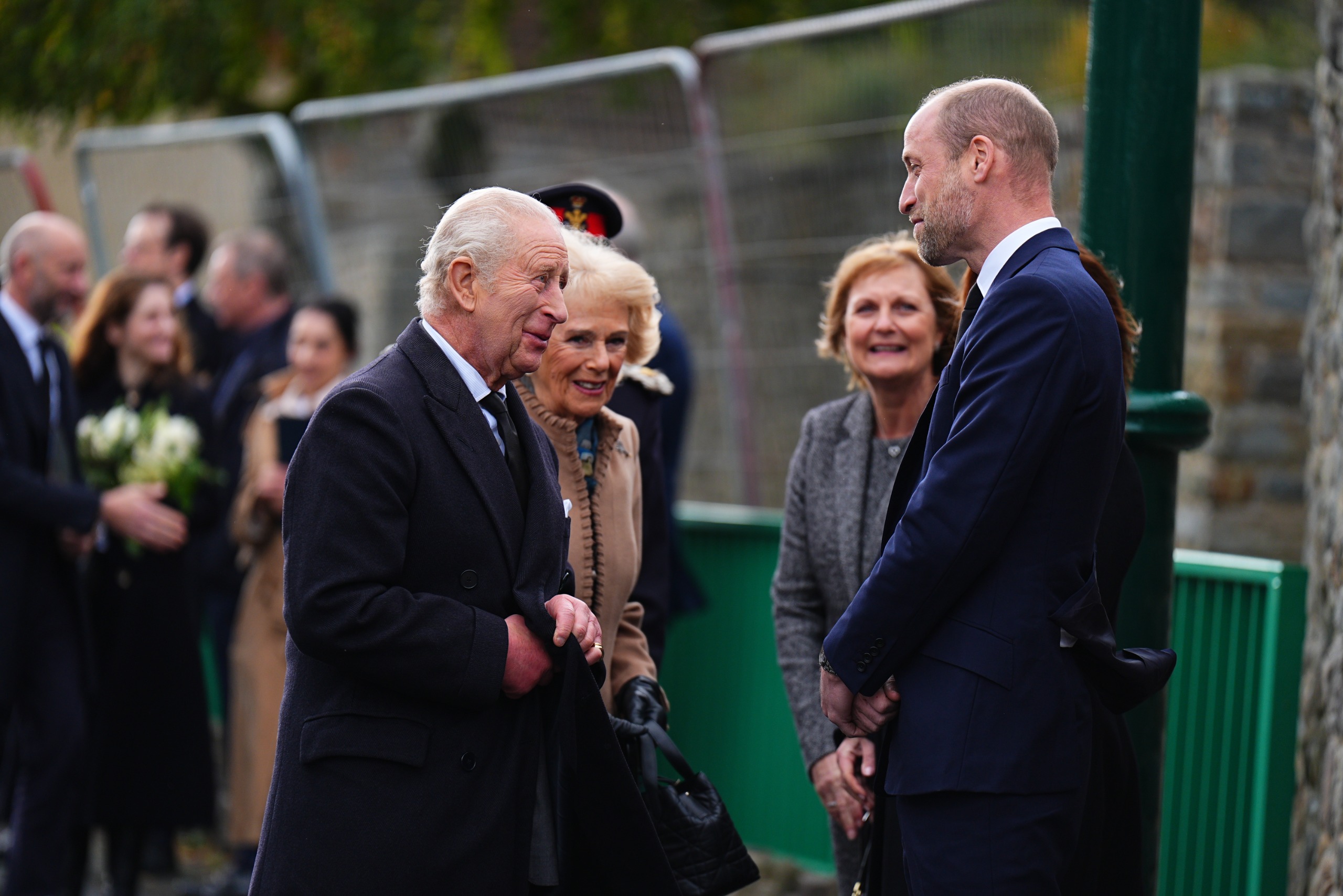 Prince William, King Charles and Queen Camilla talking outside in Aberfan, Wales