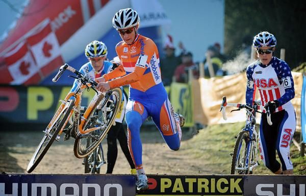 Marianne Vos (Netherlands) leads Katerina Nash (Czech Republic), left, and Katie Compton (USA) over the barriers.