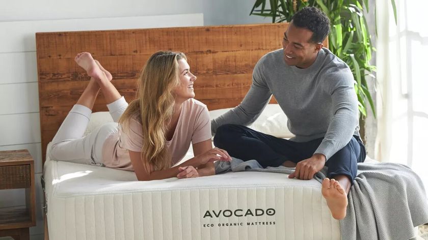 A couple sitting on an Avocado Mattress