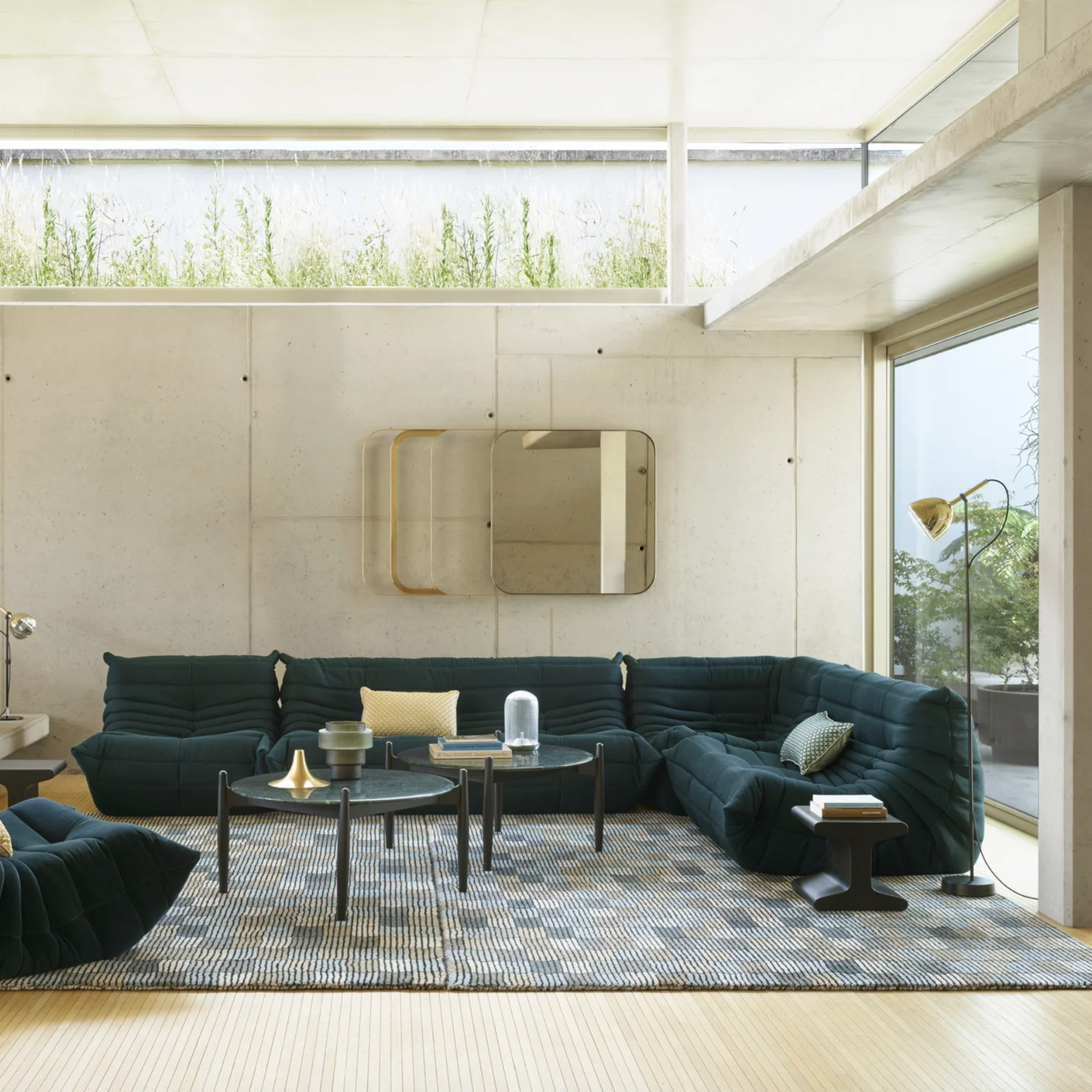 navy blue togo sofa in a minimalist living room