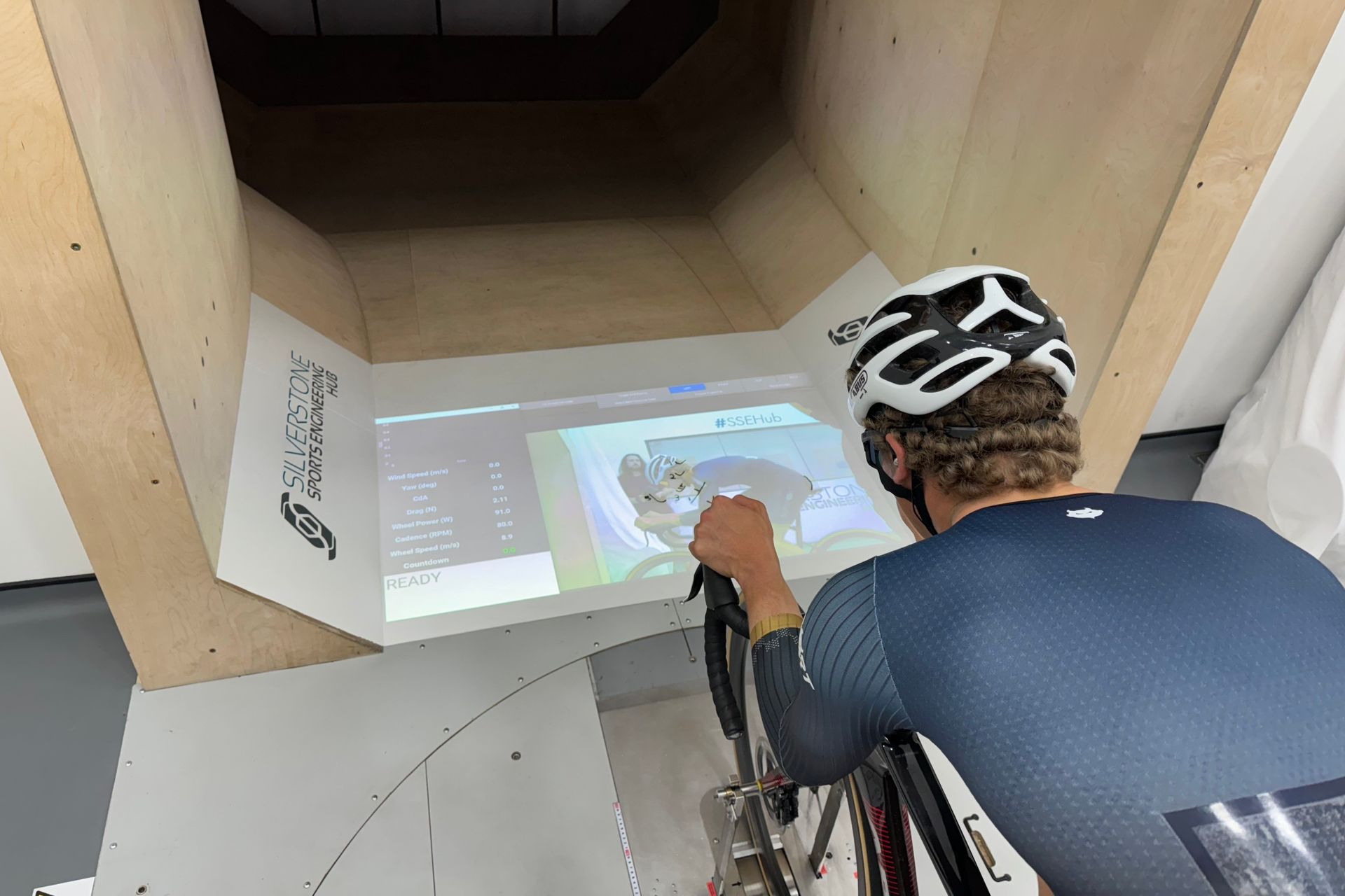 Joe riding in a wind tunnel on ultra narrow handlebars