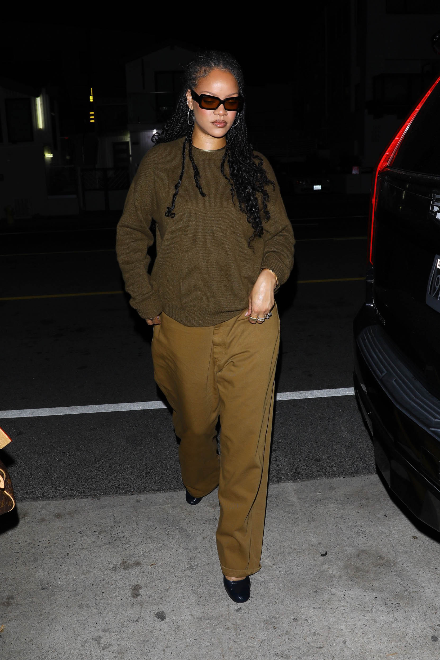 Rihanna was spotted at dinner in an off-duty, brown-on-brown outfit with high-vamp heels