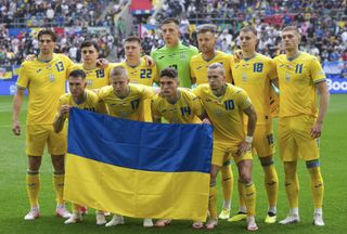 Ukraine Euro 2024 squad Players of Ukraine lineup with Ukrainian flags ahead of the UEFA EURO 2024 group stage match between Slovakia and Ukraine at Dusseldorf Arena on June 21, 2024 in Dusseldorf, Germany. (Photo by Emin Sansar/Anadolu via Getty Images)