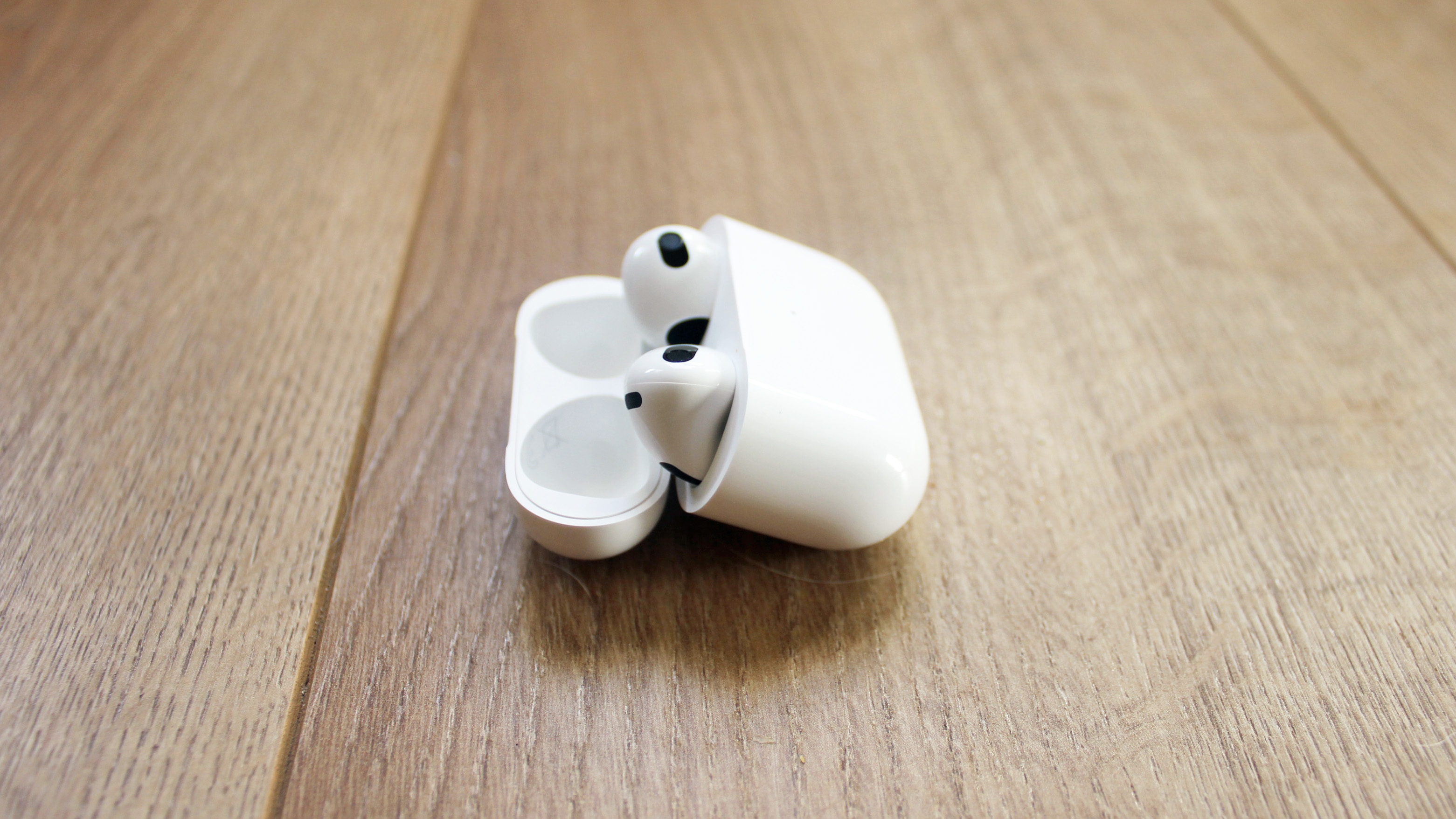 the airpods 3 inside their charging case